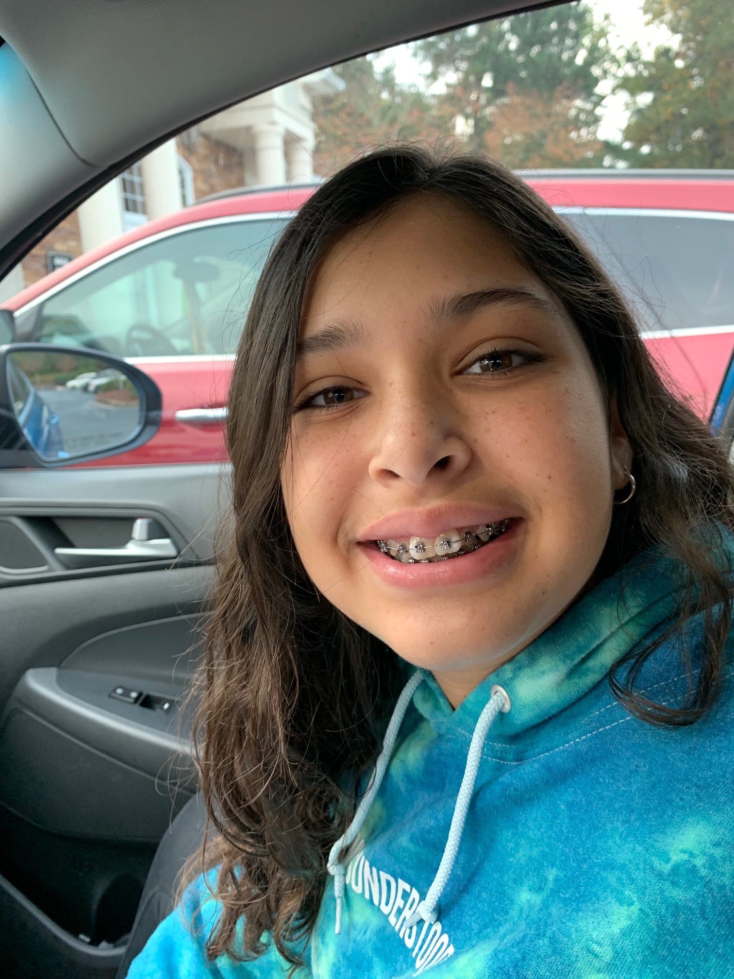 young girl smiling with braces