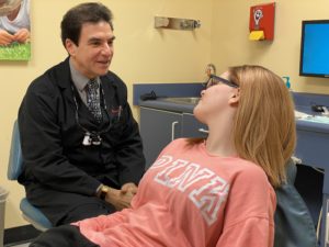 dentist talking to teen